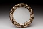 Mithé ESPELT (1923-2020) Miroir circulaire Céramique dorée à fins godrons....